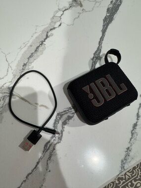 JBL Black Portable Bluetooth Speaker with Copper Logo Accent